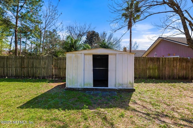 view of shed featuring a fenced backyard