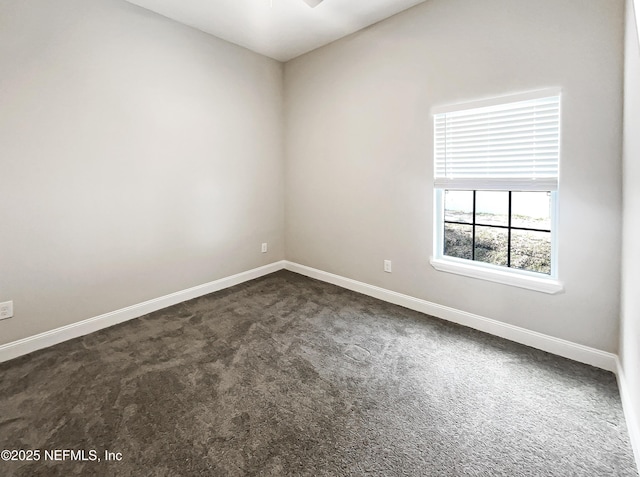 8954 5th Ave, Jacksonville, FL 32208 - empty room with baseboards and dark carpet