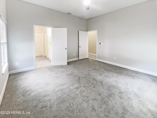 8954 5th Ave, Jacksonville, FL 32208 - unfurnished bedroom with light carpet, visible vents, baseboards, and multiple windows