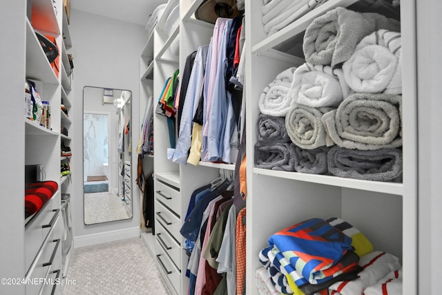 walk in closet featuring light tile patterned floors