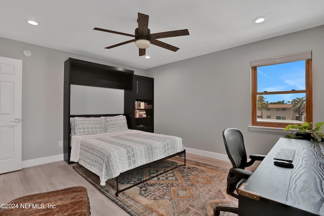 bedroom featuring recessed lighting, wood finished floors, and baseboards