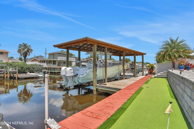 dock area with a water view and boat lift