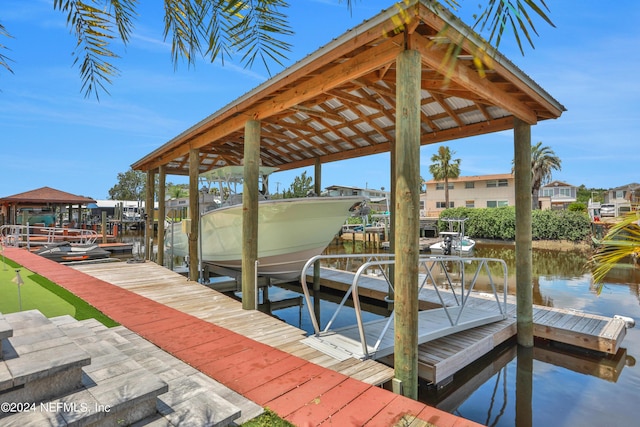 view of dock with a water view and boat lift