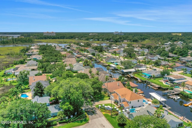 bird's eye view with a water view and a residential view