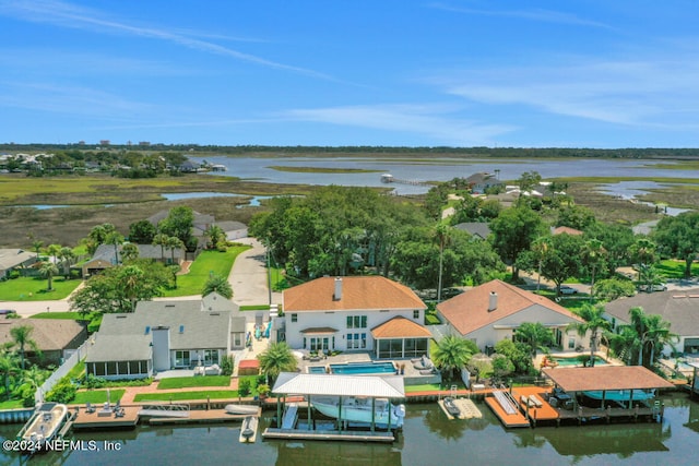 bird's eye view with a residential view and a water view