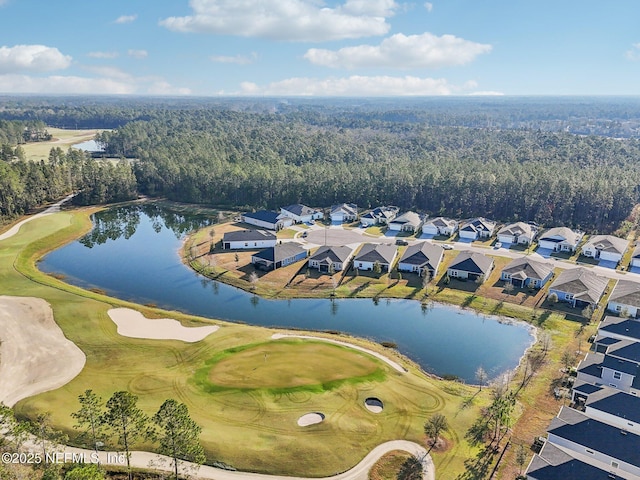 birds eye view of property with a water view, a residential view, golf course view, and a view of trees