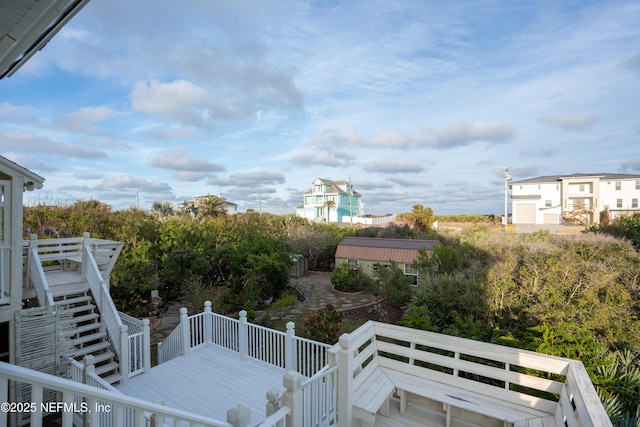 view of wooden balcony featuring stairway and a wooden deck