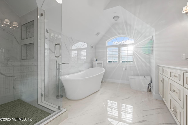 full bath featuring lofted ceiling, marble finish floor, a soaking tub, and vanity