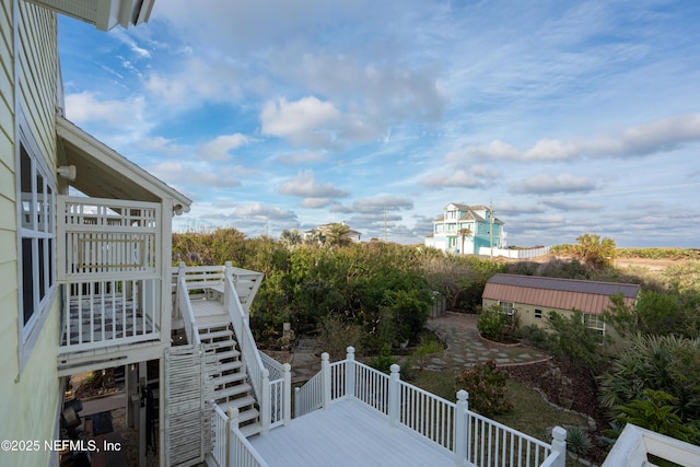 exterior space with a deck and stairway