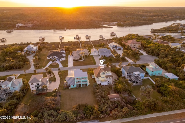 bird's eye view featuring a water view and a residential view