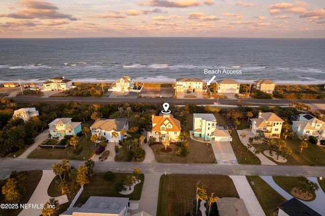 bird's eye view featuring a residential view and a water view