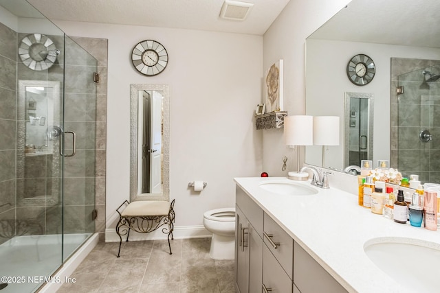 full bathroom with a shower stall, visible vents, and a sink