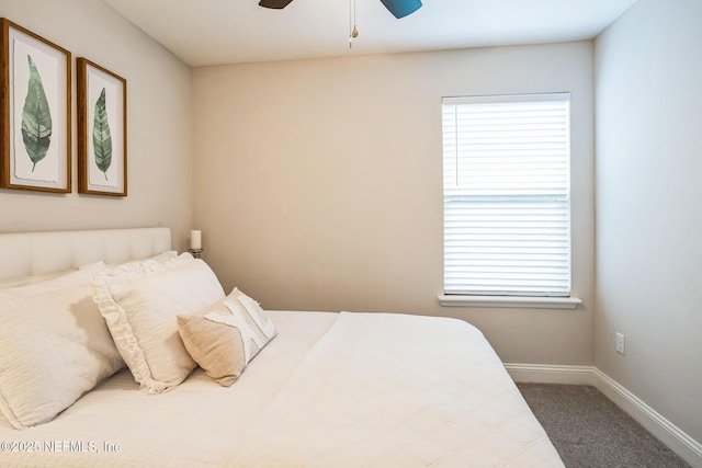 bedroom with ceiling fan, baseboards, and carpet flooring