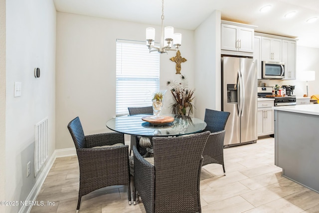 dining area featuring baseboards, visible vents, an inviting chandelier, light wood-style floors, and recessed lighting