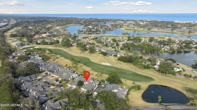 bird's eye view with golf course view, a water view, and a residential view