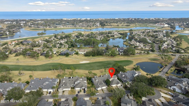 aerial view with a residential view, a water view, and golf course view