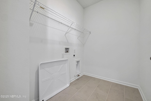 laundry room with gas dryer hookup, hookup for a washing machine, hookup for an electric dryer, laundry area, and baseboards