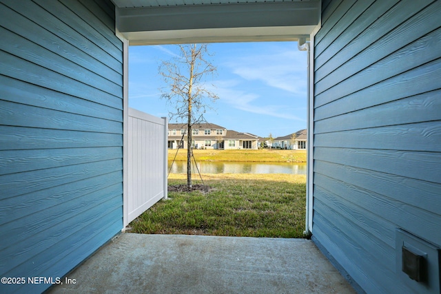 view of yard with a water view and a residential view