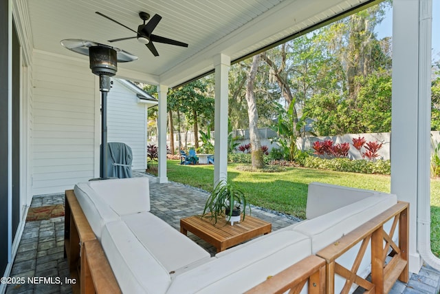 view of patio featuring a fenced backyard, ceiling fan, and outdoor lounge area