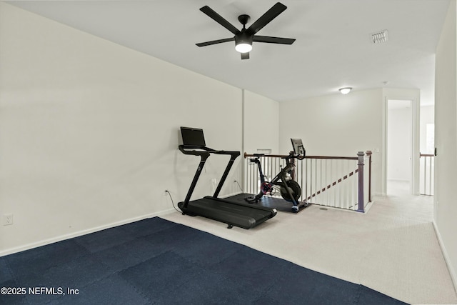 exercise area featuring baseboards, visible vents, ceiling fan, and carpet flooring