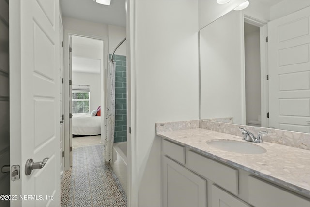 bathroom featuring toilet, vanity, and tile patterned floors