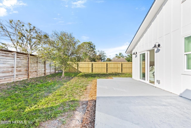 view of yard featuring a patio area and a fenced backyard