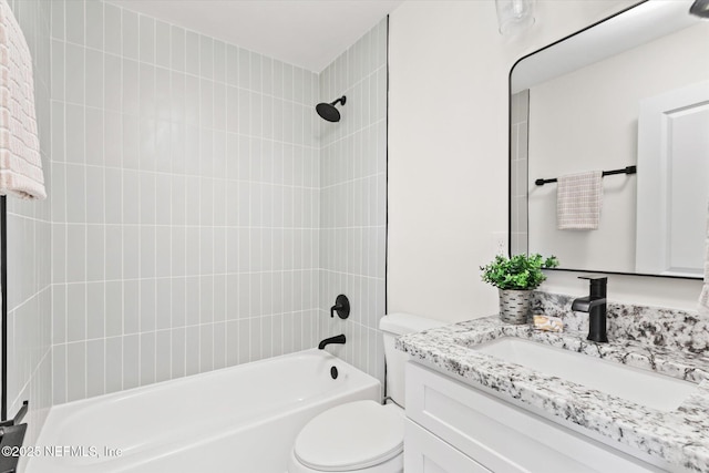 bathroom with toilet, washtub / shower combination, and vanity