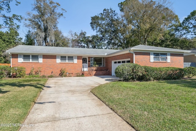 ranch-style house featuring a garage, a front lawn, concrete driveway, and brick siding