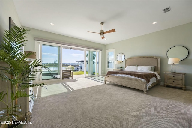 carpeted bedroom featuring ceiling fan, recessed lighting, visible vents, and access to exterior