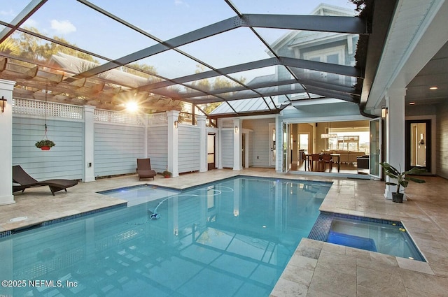 view of swimming pool with a pool with connected hot tub