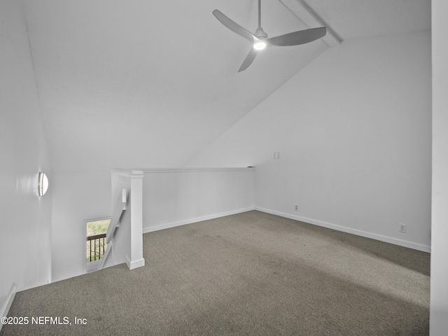 bonus room with lofted ceiling with beams, carpet, baseboards, and ceiling fan