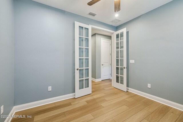 427 Ladyslipper Dr, Saint Johns, FL 32259 - spare room with light wood finished floors, baseboards, visible vents, and french doors