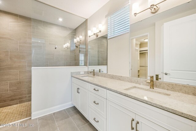 427 Ladyslipper Dr, Saint Johns, FL 32259 - bathroom featuring double vanity, a sink, tile patterned floors, and a walk in shower