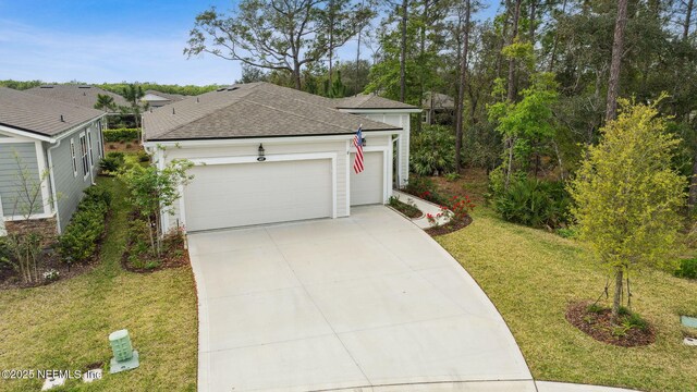 427 Ladyslipper Dr, Saint Johns, FL 32259 - exterior space featuring a front yard, concrete driveway, a garage, and roof with shingles