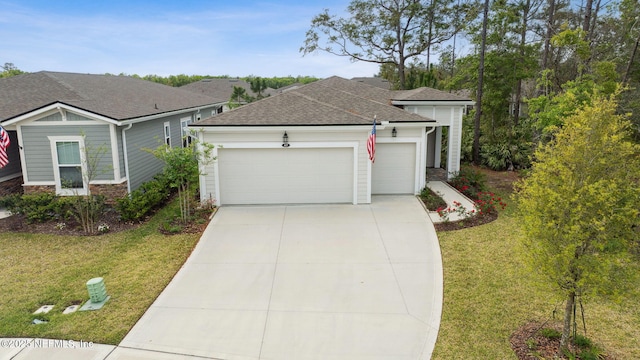 427 Ladyslipper Dr, Saint Johns, FL 32259 - view of front of home with stone siding, an attached garage, concrete driveway, a front lawn, and roof with shingles