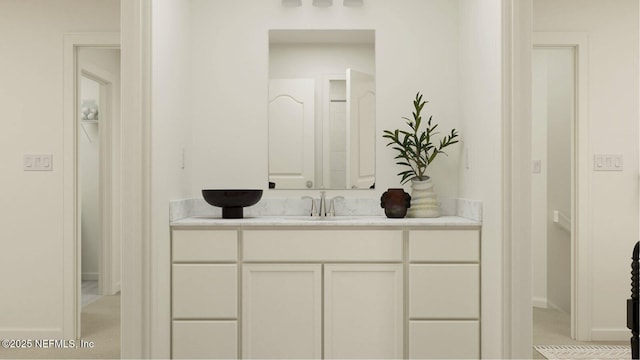 bathroom featuring vanity and baseboards