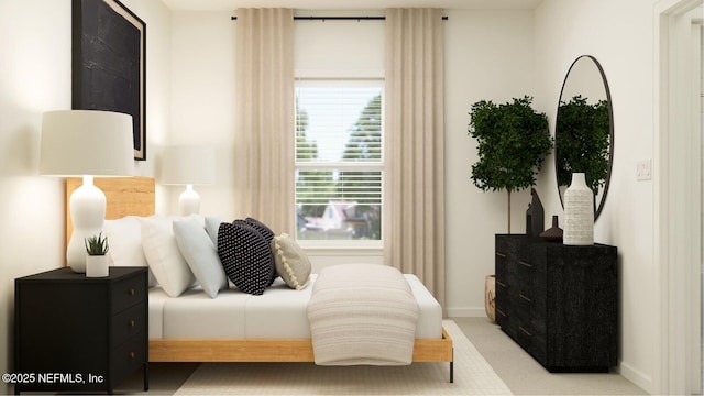 bedroom featuring light carpet and baseboards