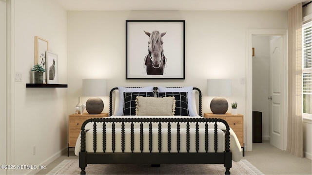 carpeted bedroom with baseboards