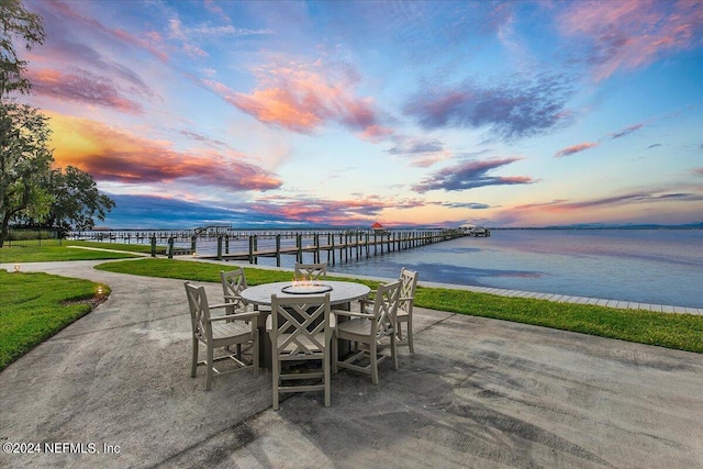 view of patio / terrace featuring outdoor dining area and a water view