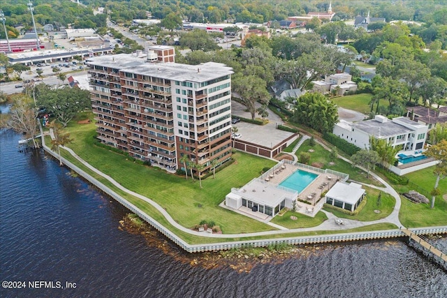 birds eye view of property with a water view