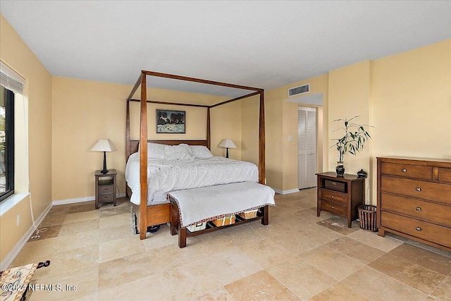 bedroom with visible vents and baseboards