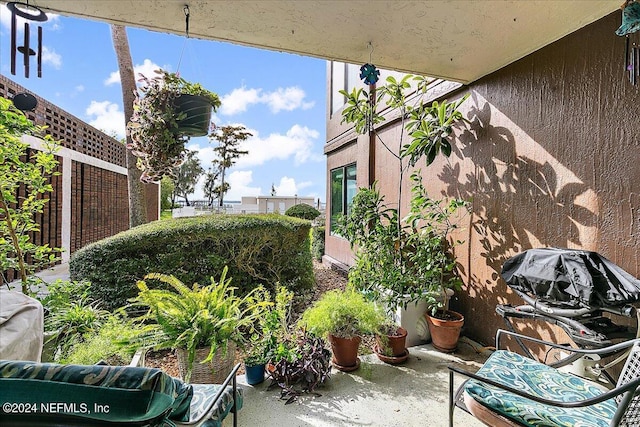 view of patio / terrace featuring a grill and fence