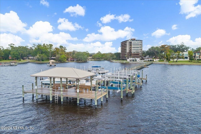 dock area with a water view and boat lift