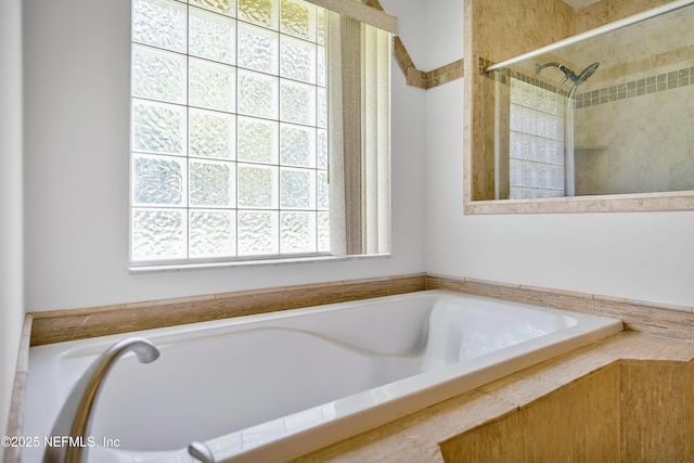 full bathroom featuring tiled bath