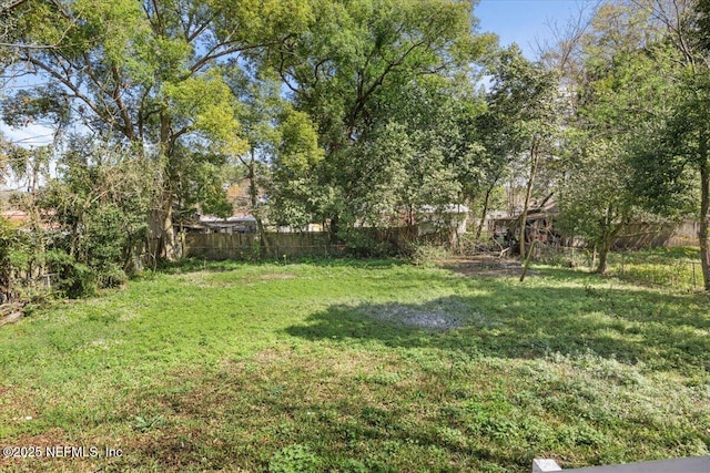 view of yard with fence