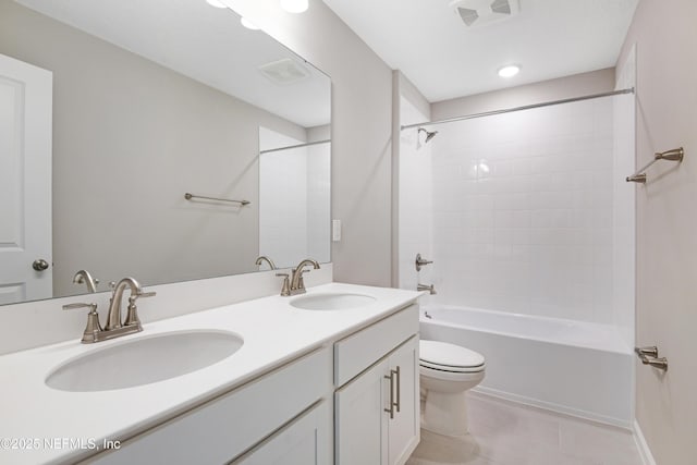 full bathroom featuring shower / bath combination, tile patterned flooring, visible vents, and a sink