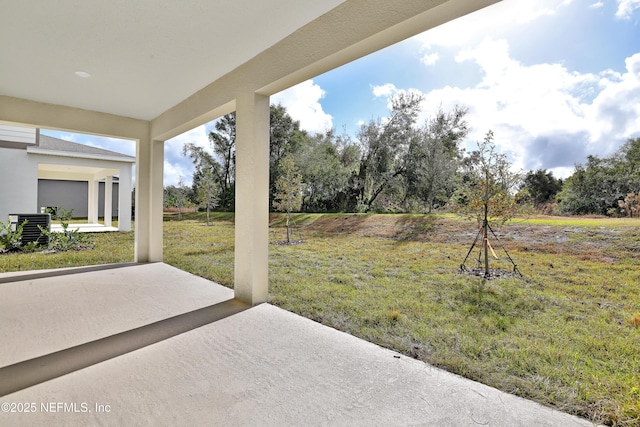 view of yard featuring a patio area and central air condition unit