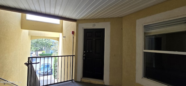 entrance to property with a balcony