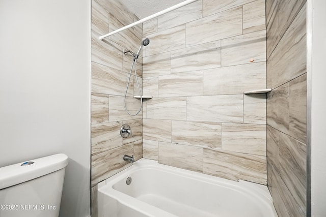 bathroom with toilet and shower / bathing tub combination