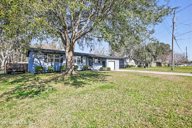 ranch-style home with an attached garage, fence, a front lawn, and concrete driveway